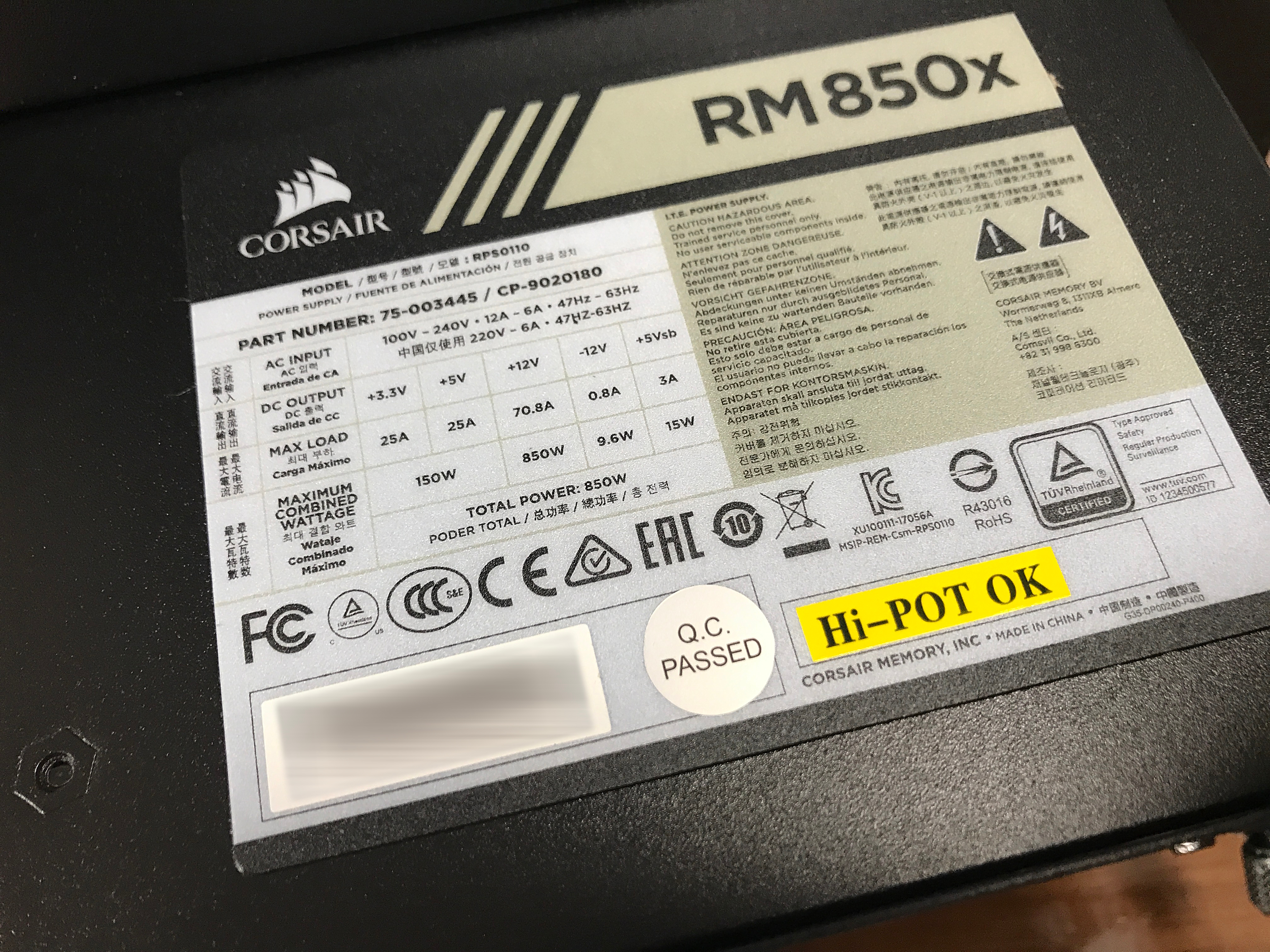 A close-up of several purple flowers with yellow centers. A few rain drops sit on the pettels